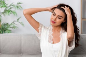 woman doing herself scalp massage