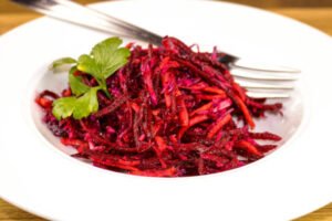 beet, carrot and red cabbage slaw with a maple syrup vinaigrette